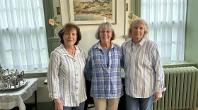 Harriet Davenport, Pam Walton and Val Starbuck of the Chesterfield Historical Society stand in the ladies room at the Stone House Tavern Museum.