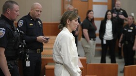 Kouri Richins, a Utah mother of three who authorities say fatally poisoned her husband then wrote a children's book about grieving, returns to the courtroom following a recess during a bail hearing Monday, June 12, 2023, in Park City, Utah. A judge ruled to keep her in custody for the duration of her trial.